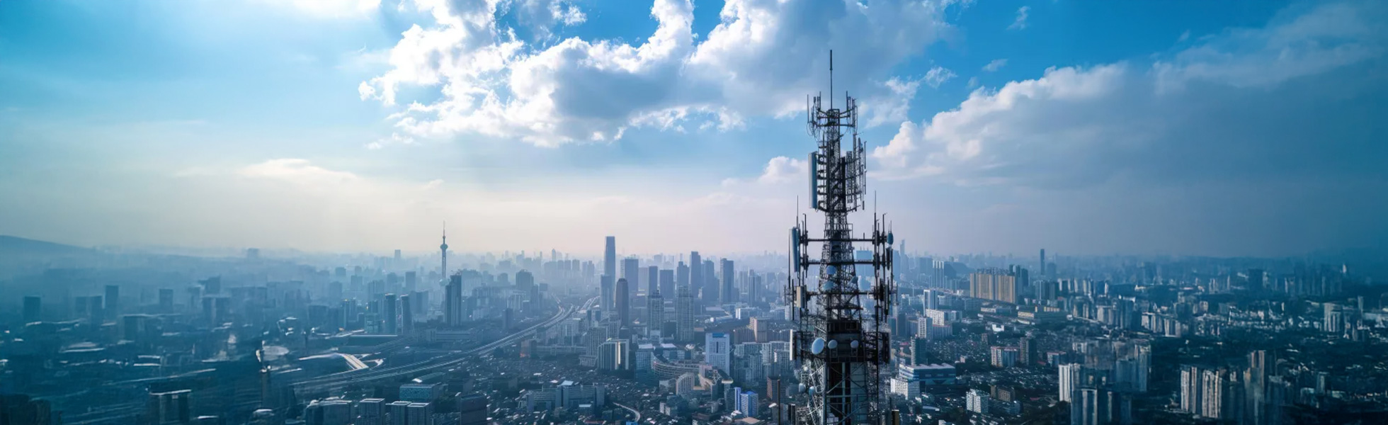 Communication tower with city skyline backdrop - ACMA frequency banner desktop