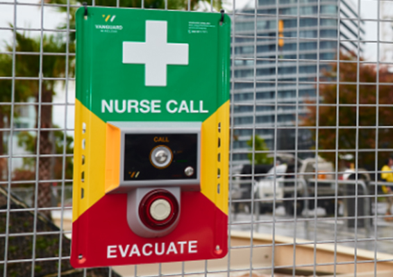 Nurse call and evacuation button system mounted on building exterior