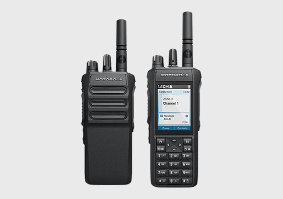 Two professional Motorola two-way radios with antennas and display screens